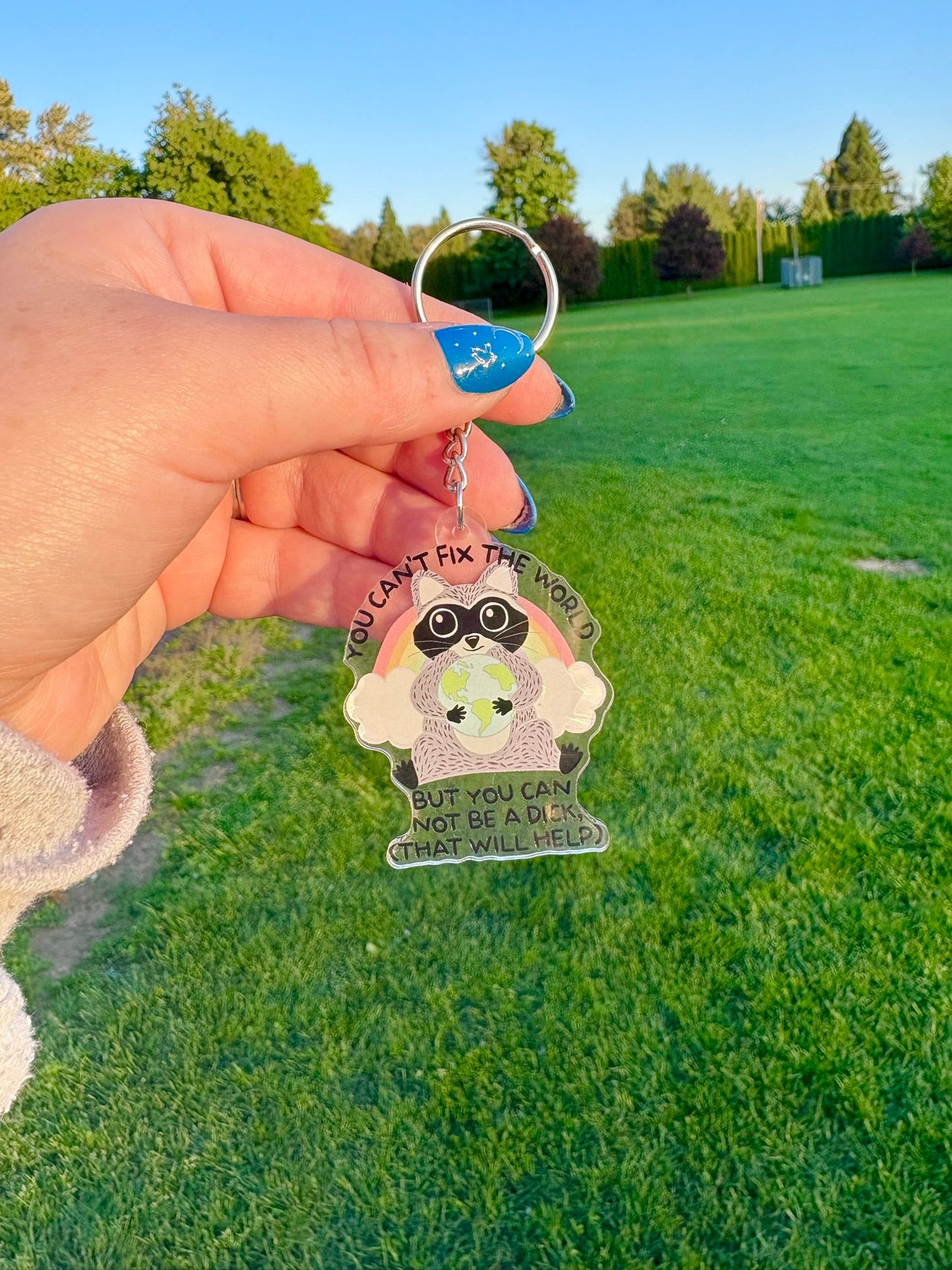 You Can't Fix the World Raccoon Keychain - Awfullynerdy.co