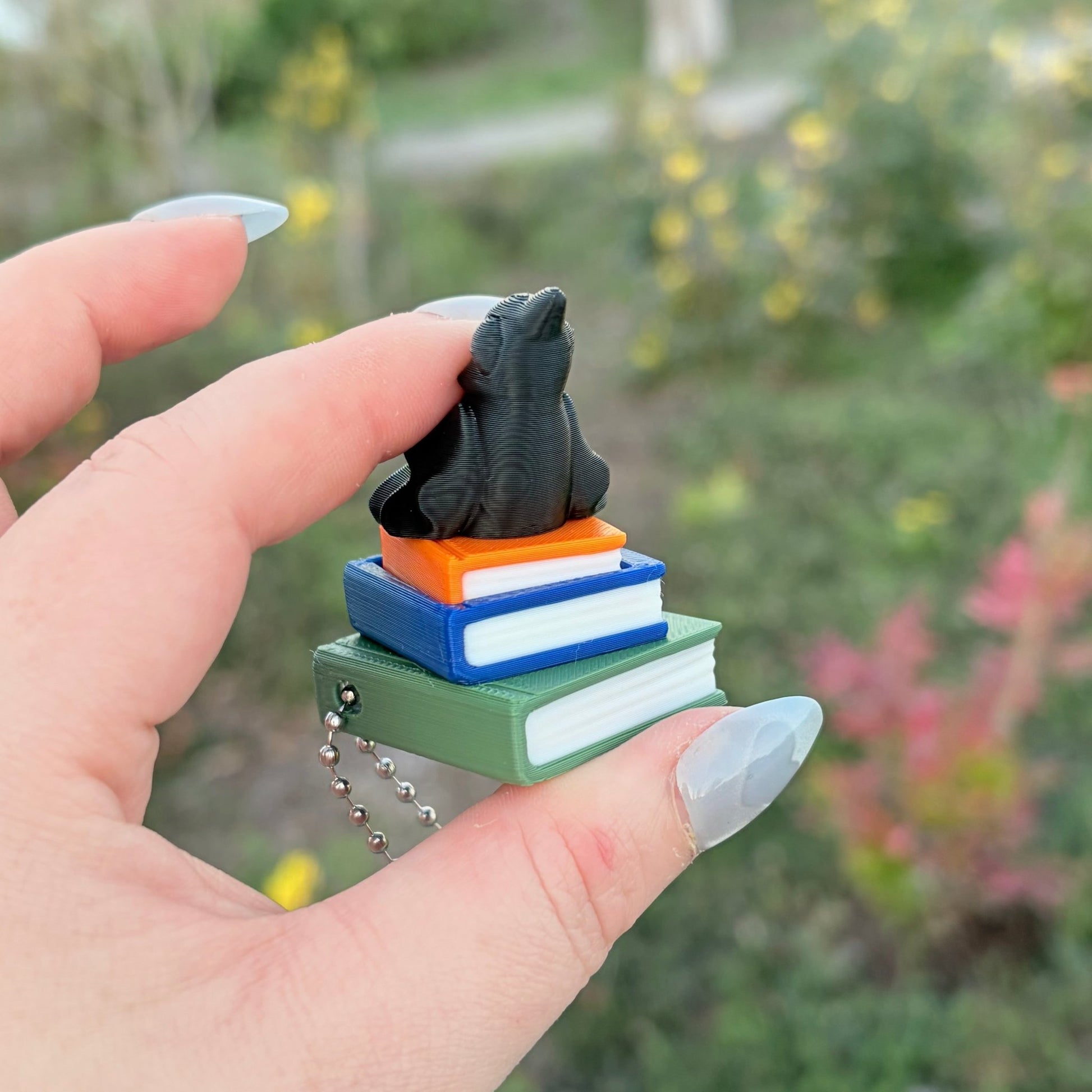 Ravenhood Inspired Book Stack Fidget Clicker Keychain - Awfullynerdy.co
