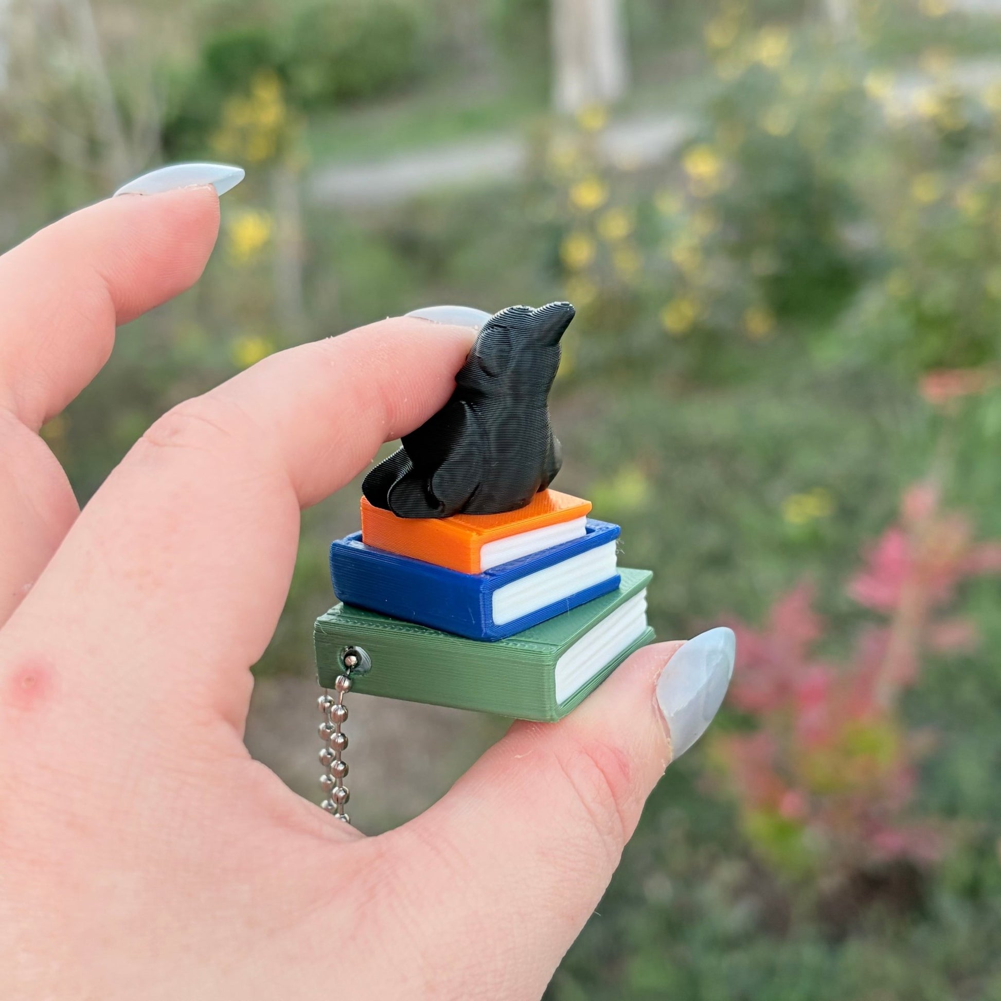 Ravenhood Inspired Book Stack Fidget Clicker Keychain - Awfullynerdy.co
