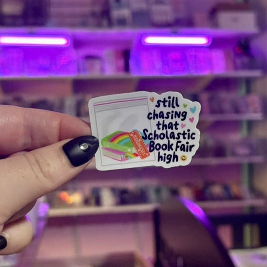 Still Chasing that Scholastic Book Fair High Sticker - Awfullynerdy.co