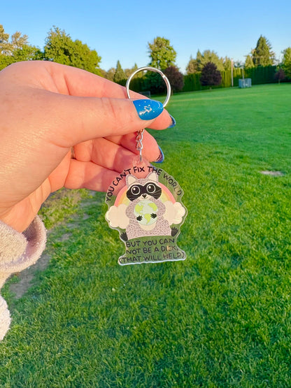 You Can't Fix the World Raccoon Keychain - Awfullynerdy.co